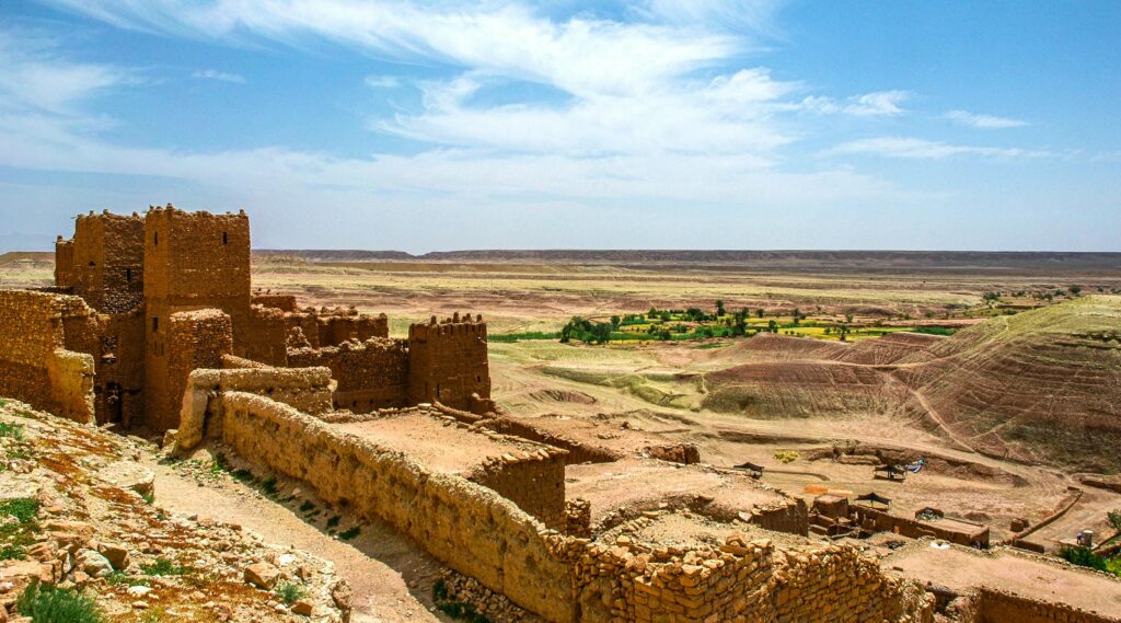Explore the majestic ruins of a fortress amidst the arid landscapes of Zagora, Morocco.